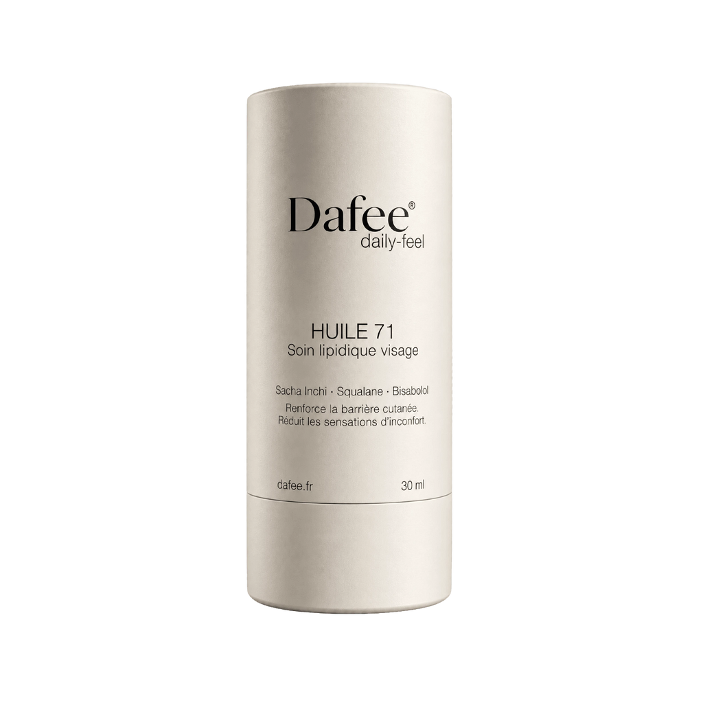 A beige cylindrical skincare product container features the brand name, product name, and ingredient list printed in black text on the front.