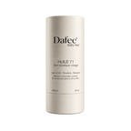 A beige cylindrical skincare product container features the brand name, product name, and ingredient list printed in black text on the front.